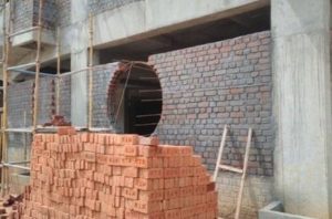 Brick masonry with circular window opening